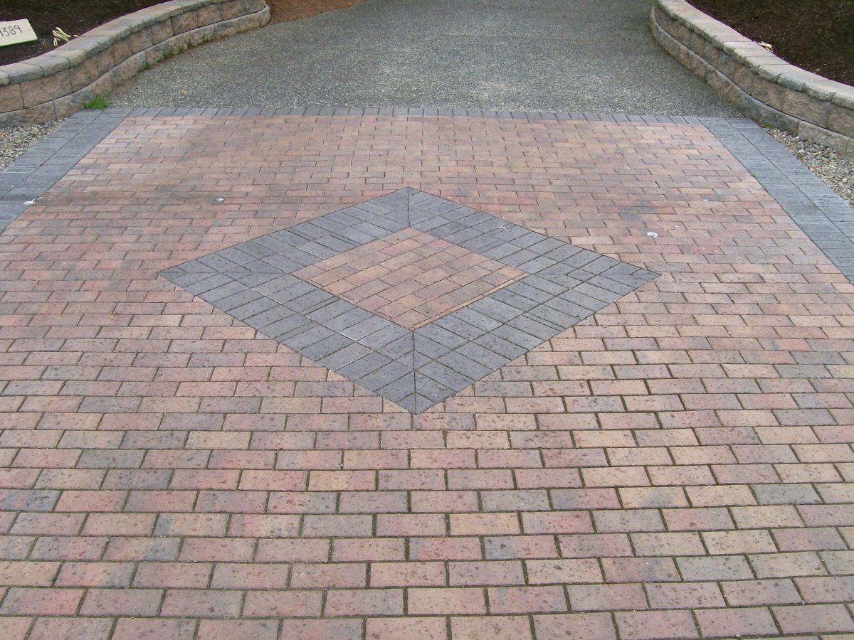 landscaping, paving stone driveway with inset brick pattern
